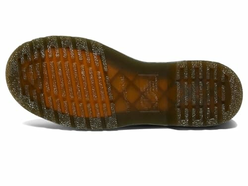 Underside view of a boot sole with tread pattern.