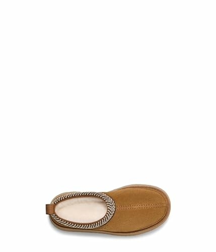 Top view of a brown slipper with patterned trim