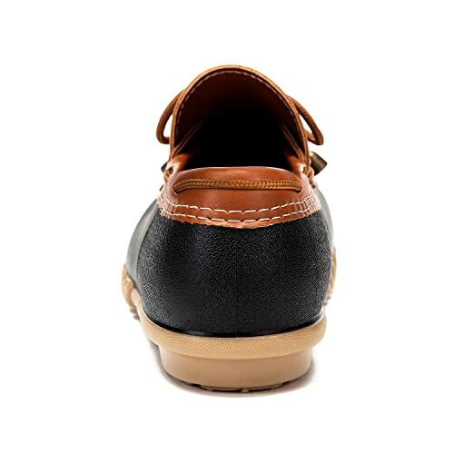 Back view of a leather boat shoe with brown and black colors.